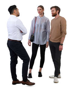 group of three people standing and talking