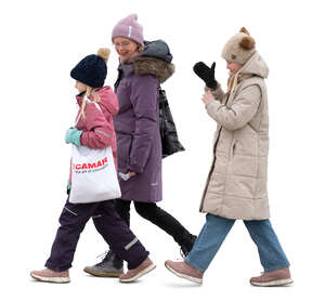 woman and two kids walking in winter