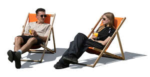 man and woman sitting on garden chairs and drinking juice