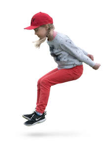 little girl with a red hat jumping