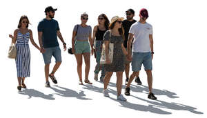 large backlit group of people walking