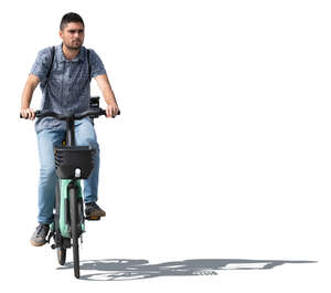 sidelit man riding a bike