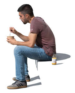 man sitting and eating his lunch