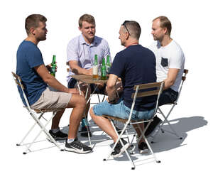 group of men sitting in an outdoor cafe