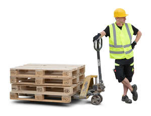 worker with a forklift and pallets