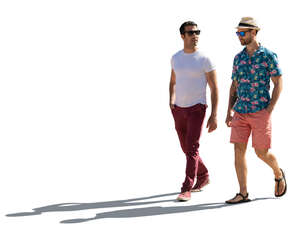 two backlit men walking