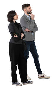 man and woman standing in a museum and talking