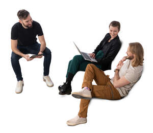 three people sitting and discussing work things