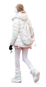 girl with white earmuffs walking