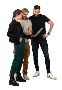 three young people ith laptop standing and discussing smth