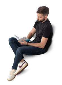 man sitting and reading a book seen from above