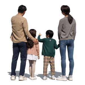 asian family with kids standing and looking at smth