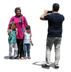 muslim man taking a picture of his family