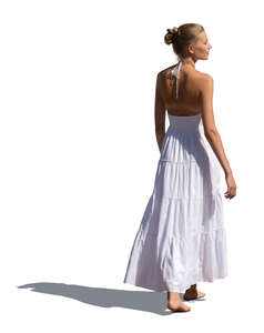 woman in a white dress walking barefoot
