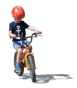 little boy riding a bike