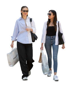 two women with shopping bags walking