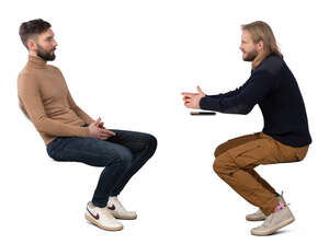 men sitting and talking