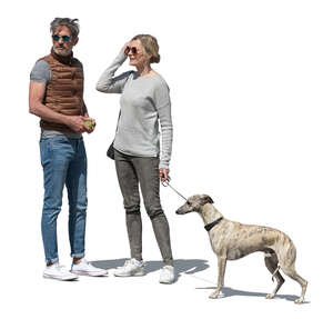 man and woman with a dog standing outside