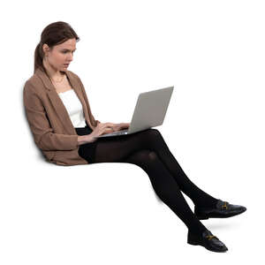 woman with a laptop sitting on a sofa