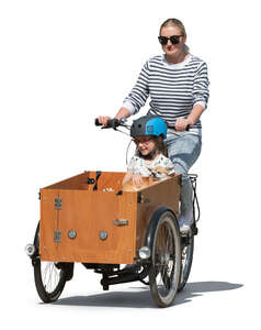 woman riding a cargo bike with her daughter and dog sitting in the box