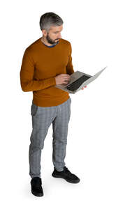 man with a laptop standing seen from above
