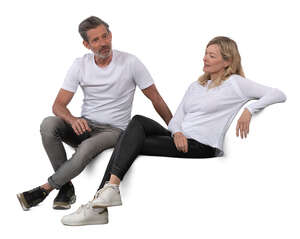 middle aged man and woman sitting on a sofa