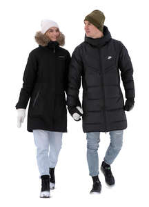 couple walking hand in hand on a snowy winter day