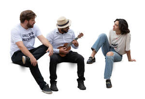 group of hispanic friens sitting and playing banjo