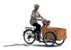 backlit family riding a cargo bike