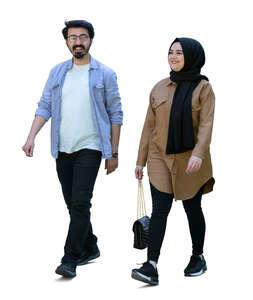 middle eastern man and woman walking