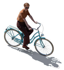 top backlit view of a woman riding a bike