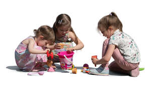 group of girls playing in the sandbox