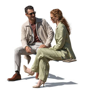 man and woman sitting outside and talking