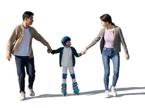 asian boy roller skating with his parents