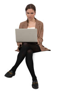 woman with a laptop sitting and working