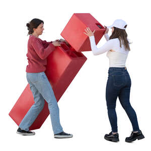 two women carrying and pulling up a large red box
