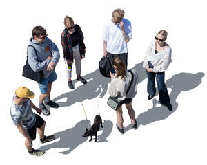 group of young people and a dog standing seen from above