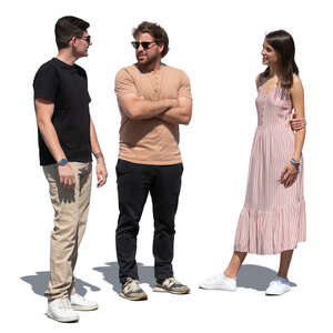 group of three people standing outside and talking