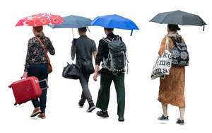 group of people with suitcases walking in the rain with umbrellas