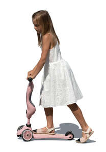 girl in a white dress riding a scooter