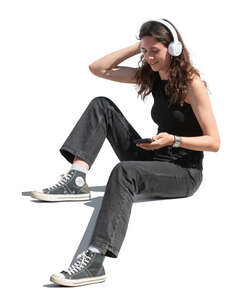 woman sitting and listening to music