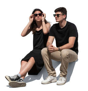 man and woman sitting in summer outside
