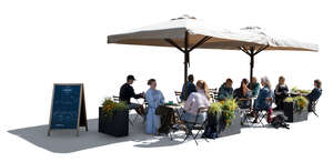 backlit outdoor cafe scene with people eating and drinking