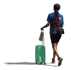 black woman with a suitcase walking