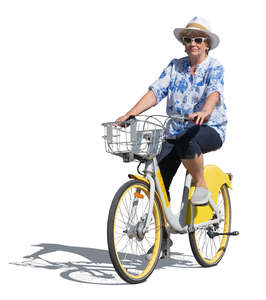 elderly woman with a hat riding a bike