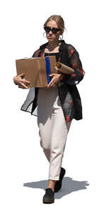 woman walking and carrying a cardboard box 