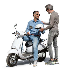 man with a motor scooter talking to a friend