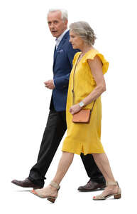 elderly couple in formal clothing walking