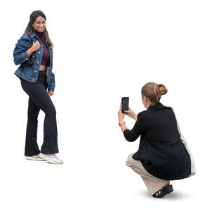 woman taking a picture of her girlfriend