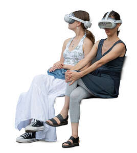 two women with VR glasses sitting